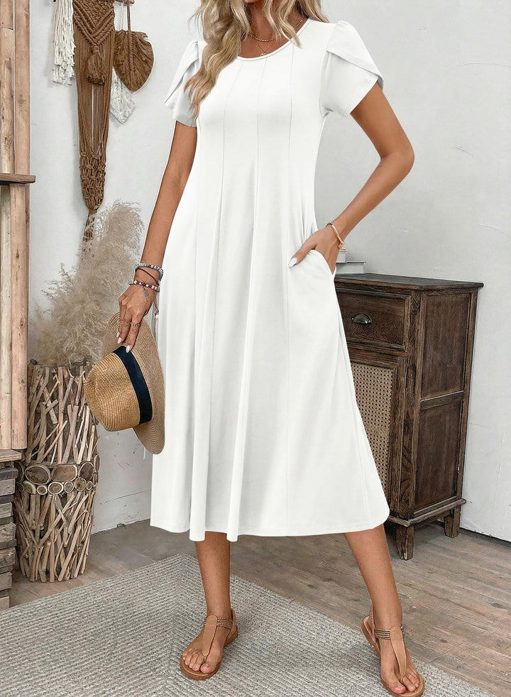 Belle robe midi femme – col rond, manches bouffantes et poches, ligne A élégante